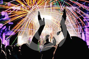 Cheering crowd and fireworks. New Year`s Eve party