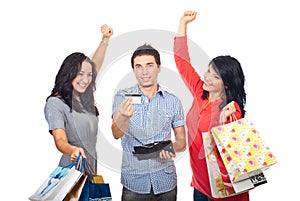 Cheering friends with credit card and shoppings