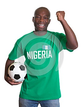 Cheering soccer fan from Nigeria with ball