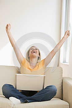 Cheering Woman with Laptop