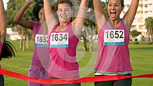 Cheering women winning breast cancer marathon