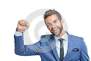 Cheerlead yourself to success. Studio shot of a happy businessman celebrating success against a white background.