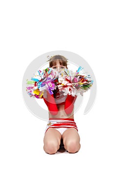 Cheerleader girl sitting with pompons