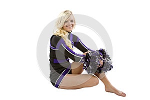 Cheerleader sitting sideways photo