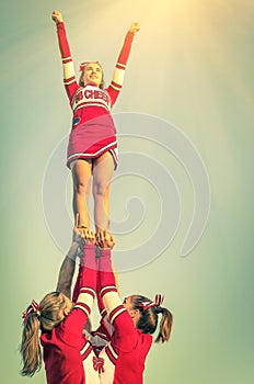 Cheerleaders in action on a vintage filtered look