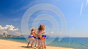 Cheerleaders from backside perform Toe Touch Basket Toss