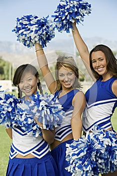 Cheerleaders Holding Pom-Poms