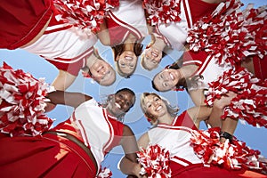 Cheerleaders in Huddle, view from below