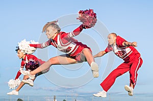 Cheerleaders team with male Coach