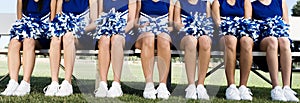 Cheerleading Squad Sitting on Bench