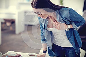 Cheerless pleasant woman having a heart attack