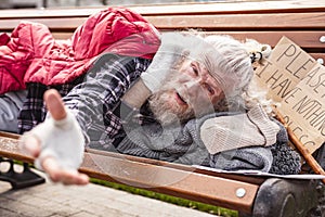 Cheerless poor man asking for help photo
