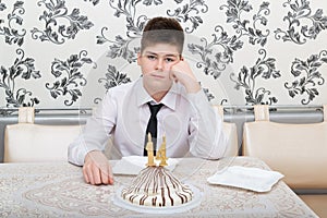 Cheerless Teen Boy On His 14th Birthday With Cake