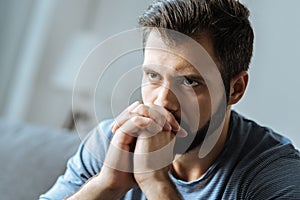 Cheerless thoughtful man feeling lonely