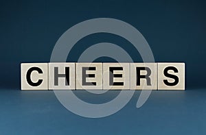 Cheers. Cubes form the word Cheers. The concept of the word Cheers