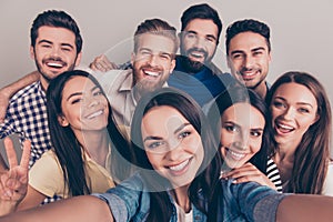 Cheers! Funky mood. Close up of an eight excited friend`s selfie