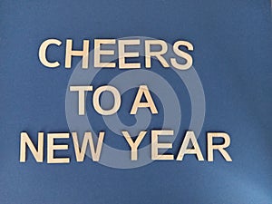 Cheers ro a new yearsign on a blue background