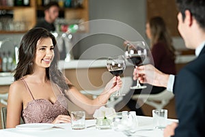 Cheers, wine and couple on date at restaurant for romantic anniversary celebration dinner together. Happy, love and