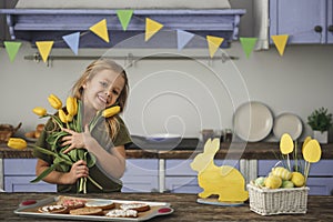 Cheery kid rejoicing spring holiday