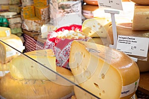 Cheese is being sold at traditional farmer`s market in the streets of Amsterdam.