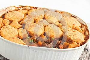 Cheese biscuits cover a savory beef stew
