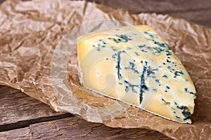 Cheese with a blue mold on the paper