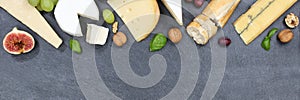 Cheese board platter plate Swiss bread Camembert copyspace banner slate top view