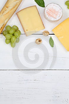 Cheese board platter plate Swiss bread Camembert copyspace portrait format top view