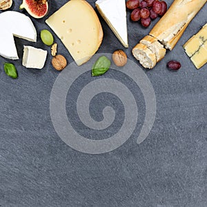 Cheese board platter plate Swiss bread Camembert copyspace square slate top view