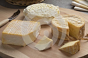 Cheese board with variation of French and Italian cheese and pieces