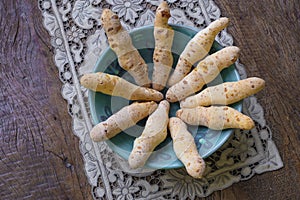 Cheese bread in the form of chopsticks in a mug