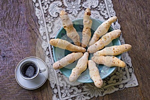 Cheese bread in the form of chopsticks in a mug