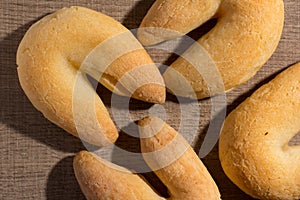 Cheese bread known as Chipa in Brazil, shaped like a horseshoe.