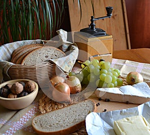 Cheese, bread, onions, wine and grinder