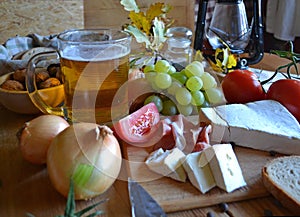 Cheese, bread, onions, wine, tomatoes and beer