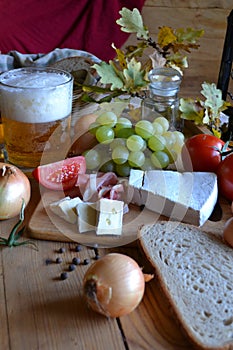 Cheese, bread, onions, wine, tomatoes and beer