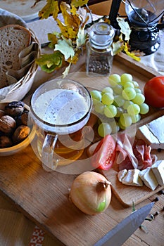 Cheese, bread, onions, wine, tomatoes and beer