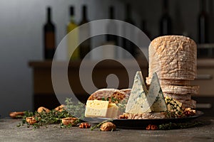 Cheese, bread, walnuts, and thyme on a kitchen table