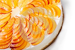 Cheese cake with peach slices isolated on white background