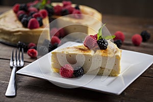 Cheese cake piece on a wooded table