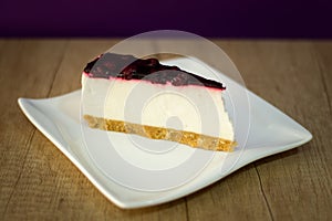 Cheese cake on white dish with fruit