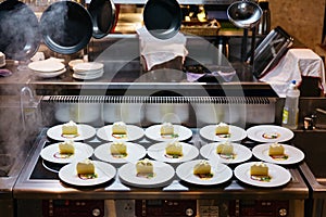 Cheese cakes in kitchen on white plates that ready to serve at cafe in Otaru. Hokkaido, Japan. photo