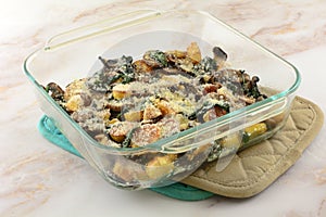 Cheese casserole of potatoes, spinach, and mushrooms