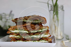 Cheese chutney sandwich. Grilled sandwiches with cottage cheese slices and green garlic condiments. Cheese chutney sandwich
