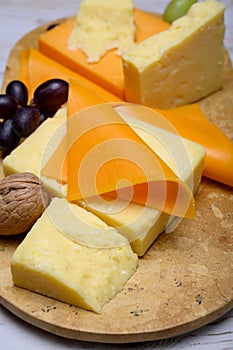 Cheese collection, blocks and slices of yellow and matured english cheddar cheese