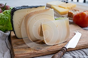 Cheese collection, French fol epi  cheese with many little holes, etorki, tomme noire des pyrenees and ossau iraty cheese