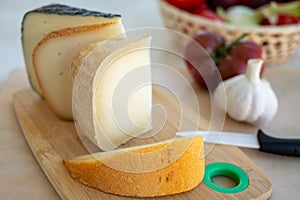 Cheese collection, French fol epi  cheese with many little holes, etorki, tomme noire des pyrenees and ossau iraty cheese