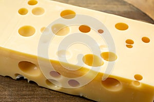 Cheese collection, french hard cheese with holes emmentaler close up