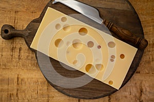 Cheese collection, french hard cheese with holes emmentaler close up