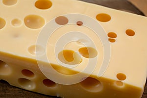 Cheese collection, french hard cheese with holes emmentaler close up